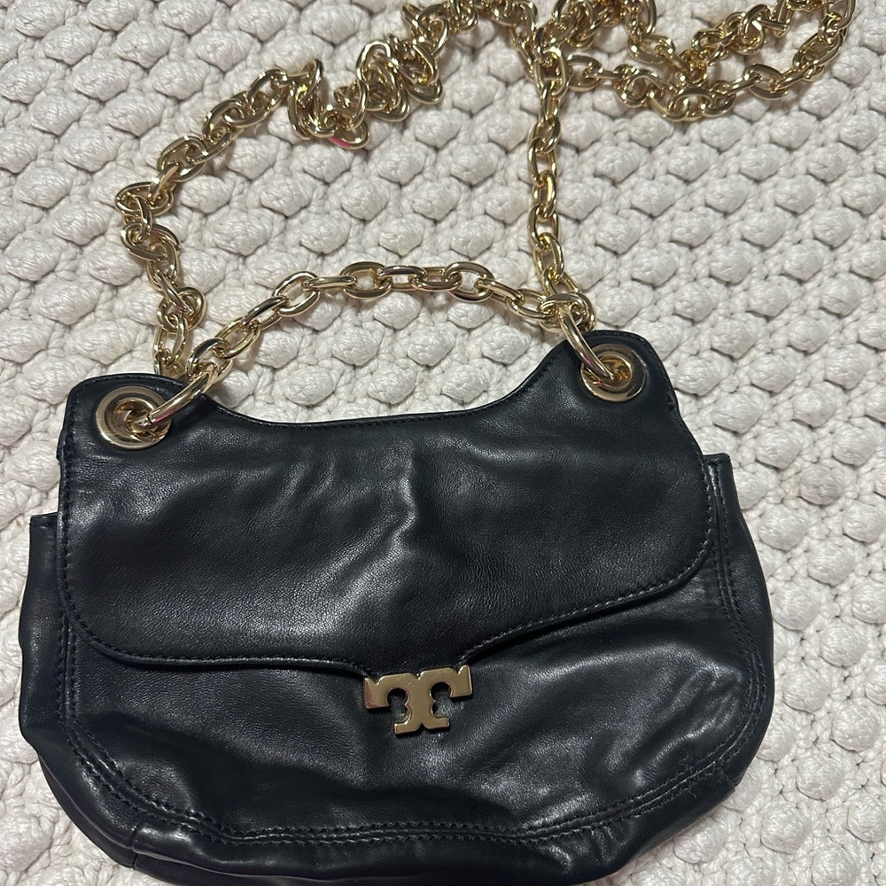 Tory Burch Megan Mini Handbag in black leather with a gold chain strap.